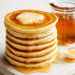 Stack of golden pikelets with butter and honey – perfect Pikelet Recipe lovers